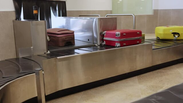 Mobile Conveyor Belt with Suitcases on It for Airport Baggage Pickup