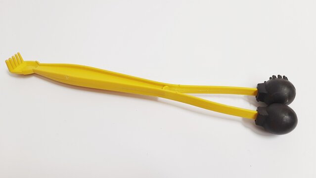 Massage tool and back scratcher isolated on white background