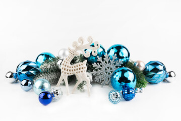 On a white background, a Christmas deer with a New Year's decor in blue tones.