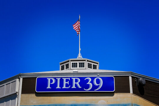 San rrancisco, Sep 9 2022 - The famous Pier 39 sign in San Francisco with American flag in the background