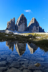 The famous landmark of Alps Peak Tre Cime de Lavaredo with reflection in Dolomites,, South Tyrol, Italy