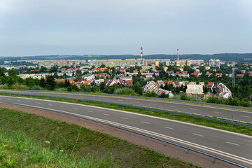 European city district, piaskowa góra wałbrzych, city panorama with a road in front, empty freeway with a city in a background, ring road in wałbrzych