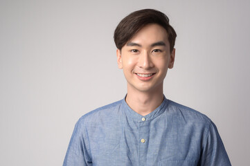 Fototapeta premium Portrait of young asian man over white background studio.