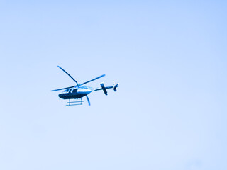 Fototapeta na wymiar A light helicopter. Aerial evolutions