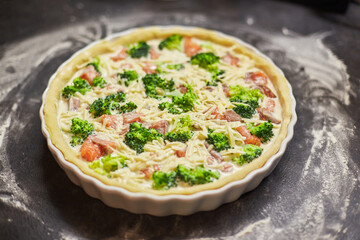 Homemade quiche with red fish, salmon, broccoli and cheese