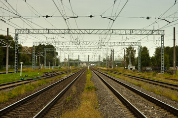 Fototapeta na wymiar railway, in the photo straight lines of railway tracks against a gray sky
