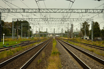 Fototapeta premium railway, in the photo straight lines of railway tracks against a gray sky