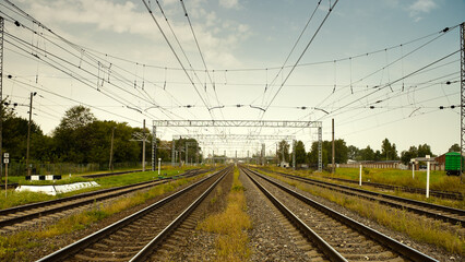 Fototapeta premium railway, in the photo straight lines of railway tracks against a gray sky