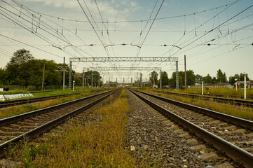 Fototapeta premium railway, in the photo straight lines of railway tracks against a gray sky