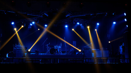 Stage lighting beams spotlight and smoke of events show or concerts