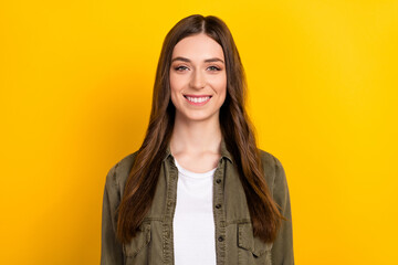 Photo of satisfied young lady toothy beaming smile look camera isolated on yellow color background