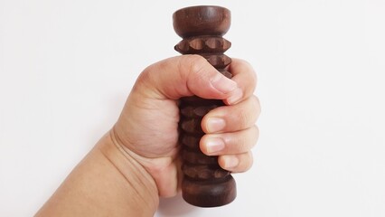 Wooden hand grip massage tool isolated on white background