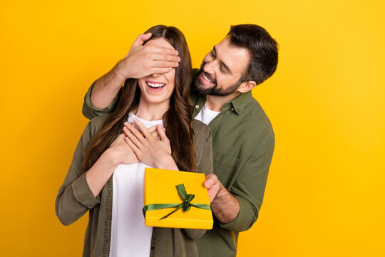 Photo of handsome guy attractive lady close eyes give giftbox isolated on yellow color background