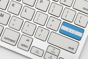 national flag of honduras on the keyboard on a grey background .3d illustration