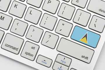 national flag of saint lucia on the keyboard on a grey background .3d illustration