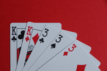 poker full house on a red background