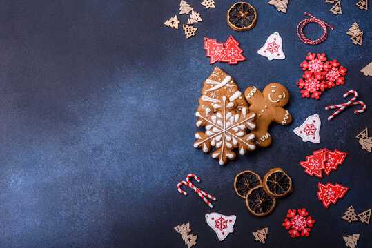 Christmas Homemade Gingerbread Cookies On A Dark Concrete Table