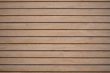 Arranged pattern  brown wooden planks board background makes you feel warm and natural.