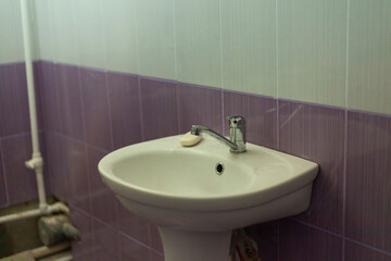 Sink in bathroom. Hand washbasin. Restroom in house.