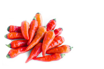 Pile of red ripe Karen chilies peppers (Prik Ka Reang) isolated on white background. Concept : food ingredient, hot and spicy taste for cooking Asian food. 