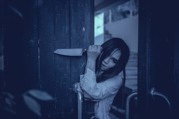 Portrait of asian woman make up ghost face with blood,Horror scene,Scary background,Halloween...