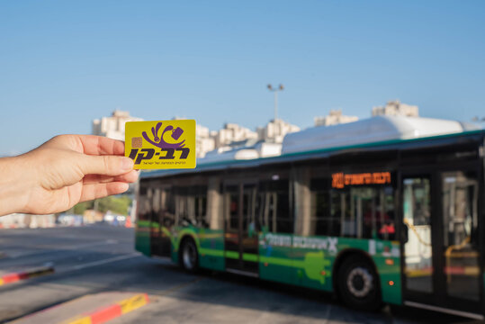 Rishon Lezion / Israel – 14 September 2022. Travel card Rav Kav in hand. Israel Green Autobus Egged company. Passenger bus. Israeli public transport. Central bus station. Modern shuttle.