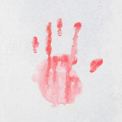 Red hand paint print on gray wall background. Handprint graffiti concept