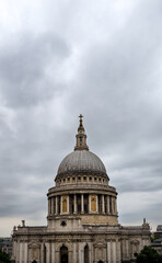 Fototapeta na wymiar View of Saint Paul Cathedral's dome on a cloudy summer afternoon, London, England