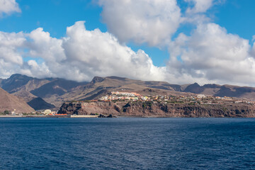 Panoramic view from the ferry on the port of San Sebastian de La Gomera, La Gomera and Tenerife, Canary Islands, Spain, Europe. Spring and summer. View on the beach and the hills in the backcountry