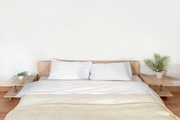 Comfortable bed, white bed sheets and pillows