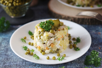 Olivier salad, traditional Russian dish, served on the plate