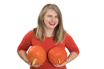 Portrait of beautiful middle-aged blonde woman with pumpkin ready for halloween celebration, mockup...