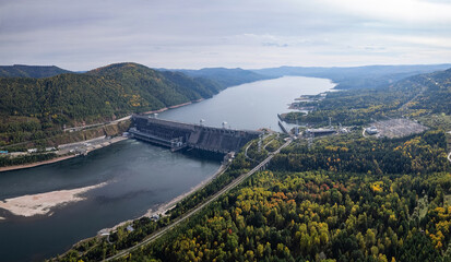 Fototapeta na wymiar View of the hydroelectric dam on the river, aerial shot