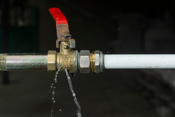 Crack on the water tap and a water leak after the spring frost