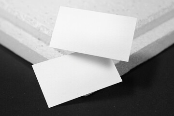 Clean minimal business card mockup floating on plate