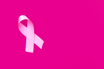 Obraz na płótnie Canvas Pink October. Pink ribbon on pink background.