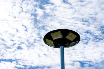 solar light blue sky background with white clouds on a clear day, Solar cell lamp, and Alternative energy from the sun.