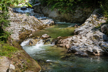 Landscape on the upper course of the river Gilort, Gorj, Romania. Mountain river with clear and clean water.