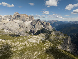 Dolomite Mountains, Dolomite Alps or Dolomitic Alps, are a mountain range located in northeastern Italy. Unesco world heritage. limestone alps grassland and cliff nature aerial drone overhead view.