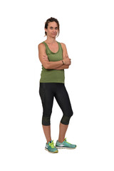 view of a  woman arms crossed and looking at camera with sportswear on white background