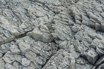 natural background, rock texture from weathered columnar basalt