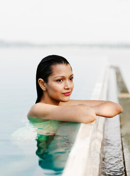 Woman bathing in a Pool at Hotel, Dambulla, Sri Lanka.  