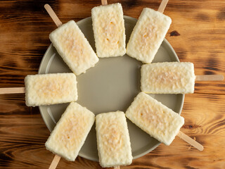 Orange ice cream with white milk chocolate.