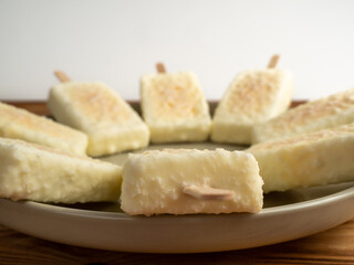 Orange ice cream with white milk chocolate.