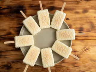 Orange ice cream with white milk chocolate.