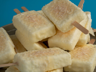 Orange ice cream with white milk chocolate.