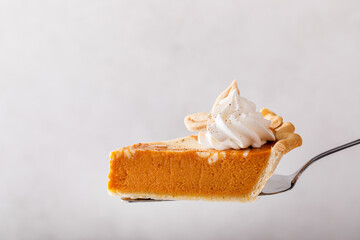 Pumpkin cheesecake swirl pie topped with whipped cream