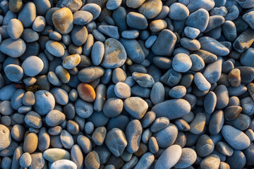 Round pebbles on a beach near Cape Agulhas. L'Agulhas in the Overberg, Western Cape, South Africa.