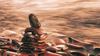 Heap of wet stones on a blurred background - obrazy, fototapety, plakaty