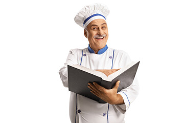 Cheerful mature male chef smiling and holding a cook book